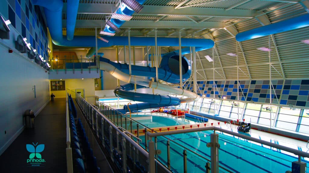 blue ducting in large swimming pool area