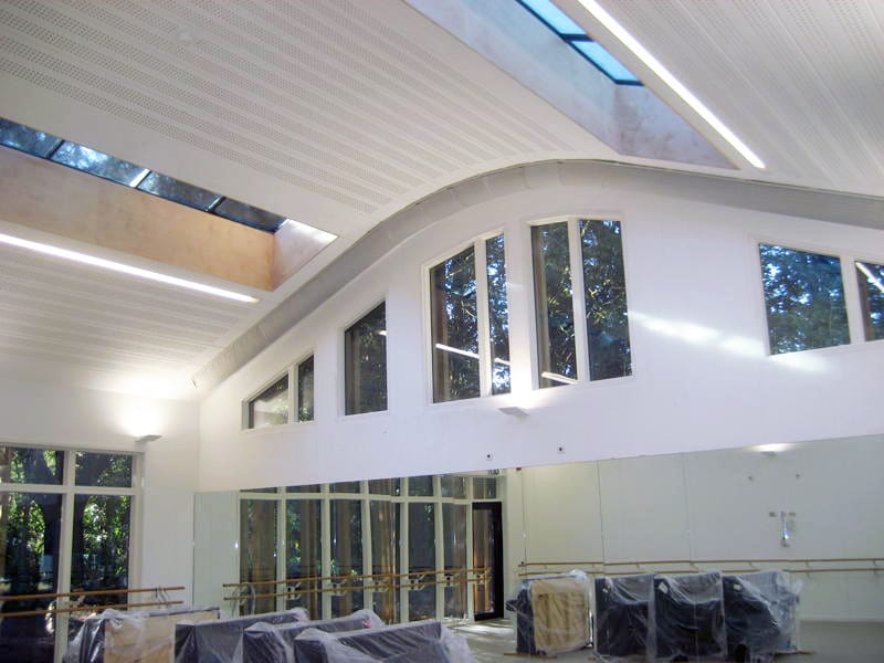 Exposed ductwork: fabric ducts follow the curved profile of the ceiling.