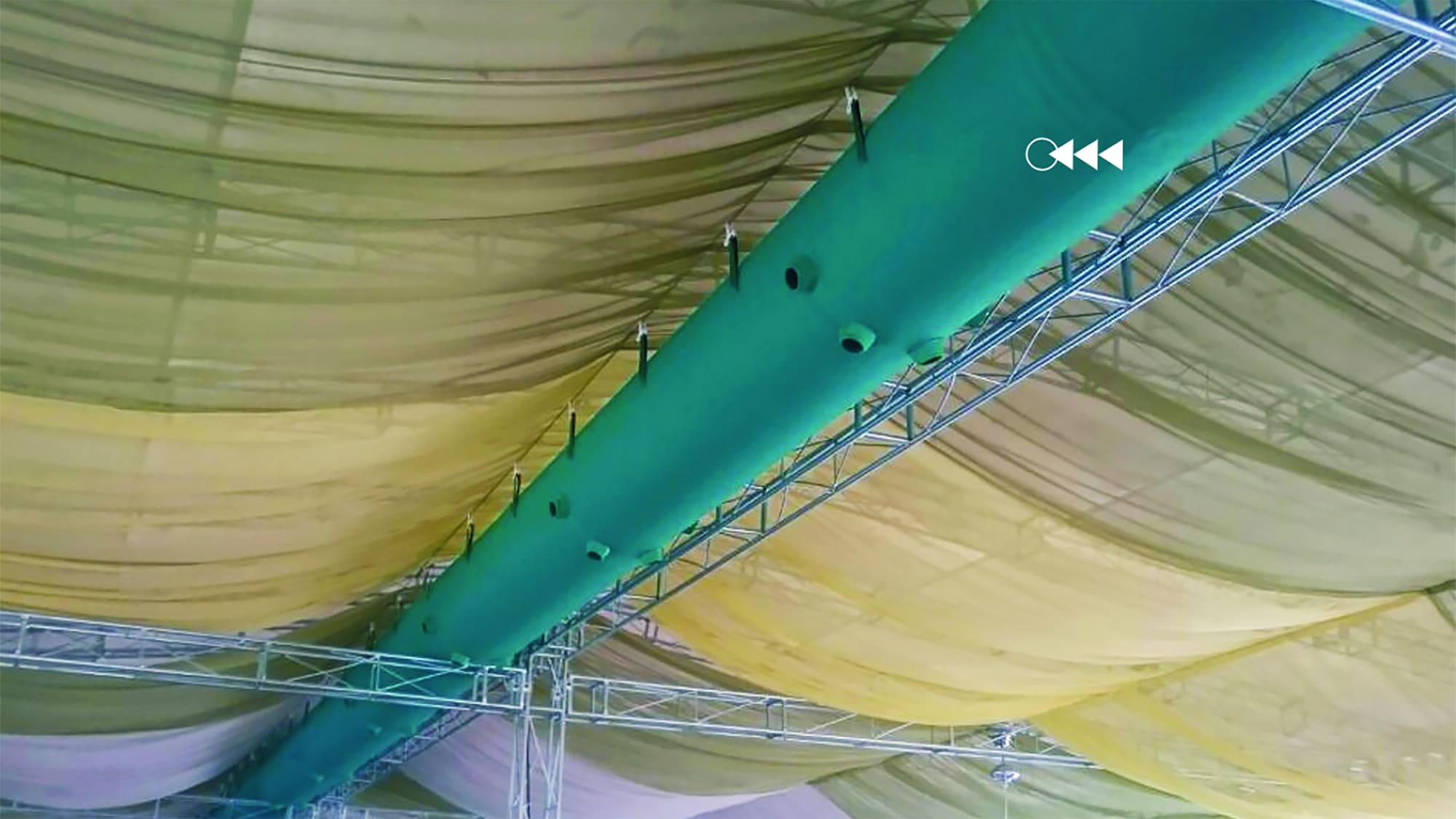 turquoise fabric ducts in a marquee