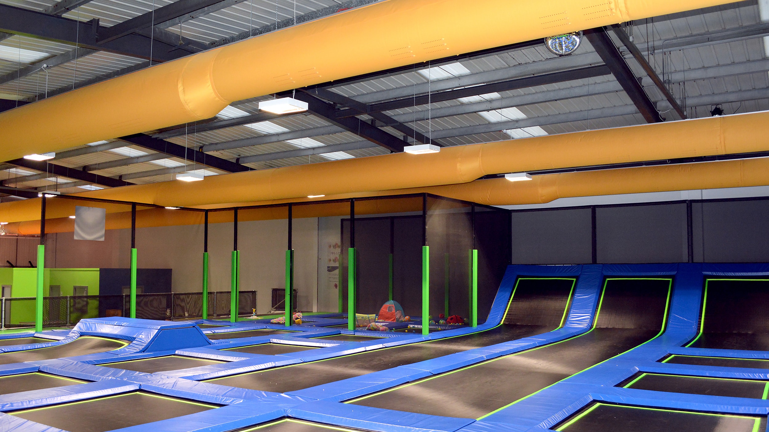 Fabric ducting in a trampoline park