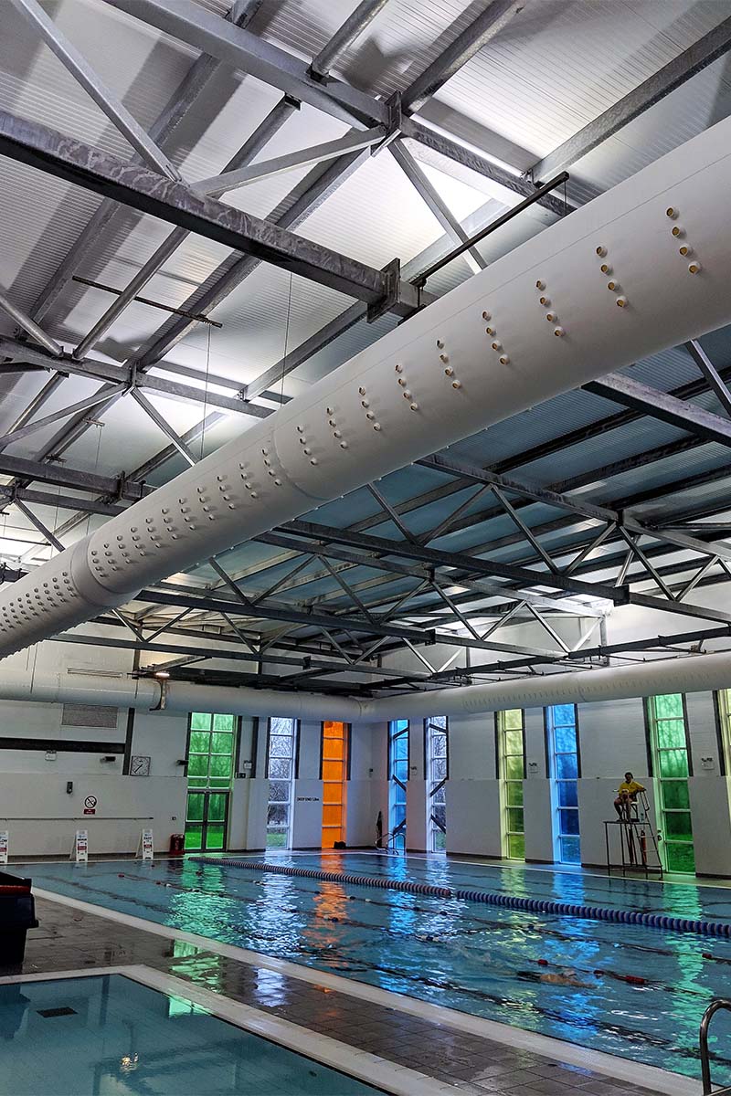 Swimming pool ventilation with fabric nozzles