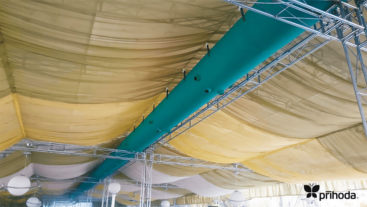 Lightweight green fabric duct in a marquee